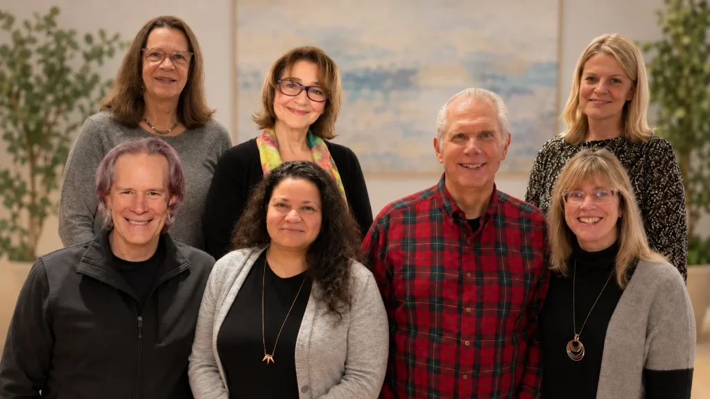 The Healthy Way team, seven people standing together indoors.
